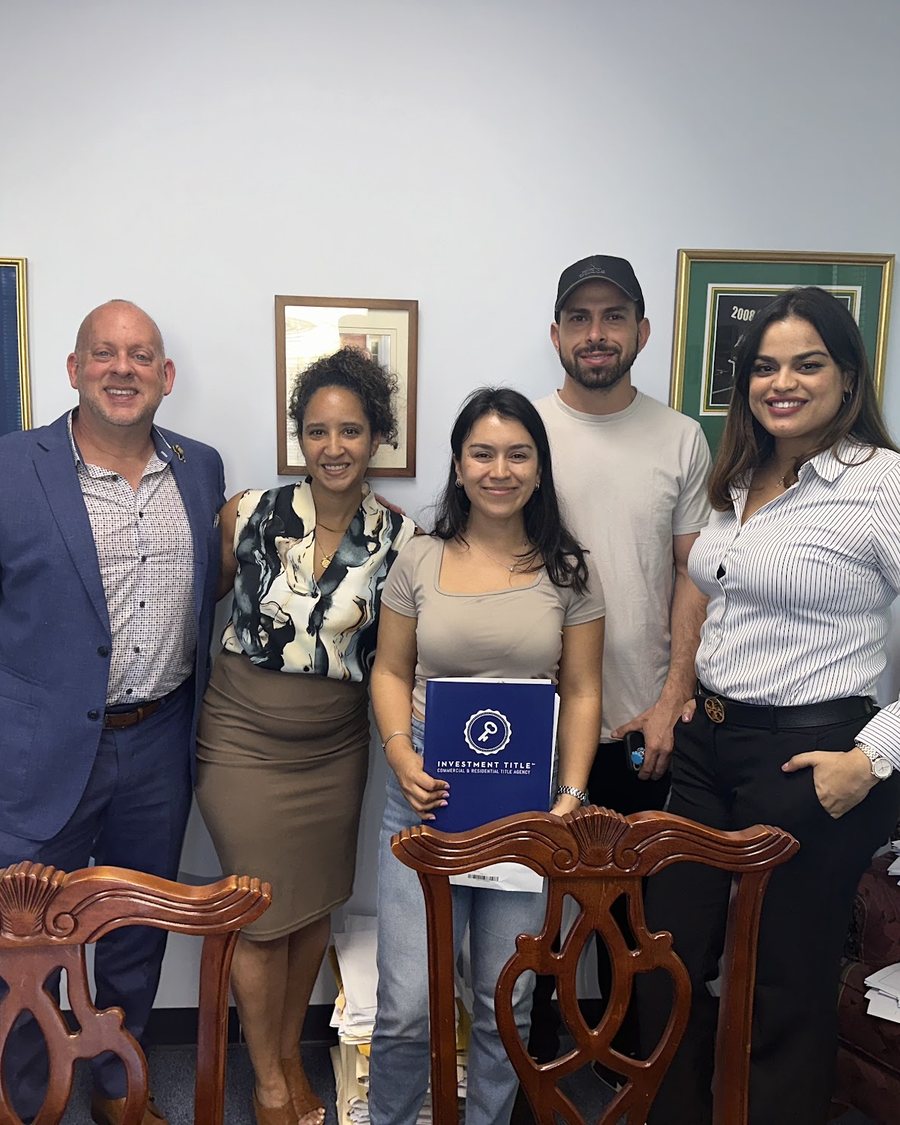 Cindy with her clients on closing day